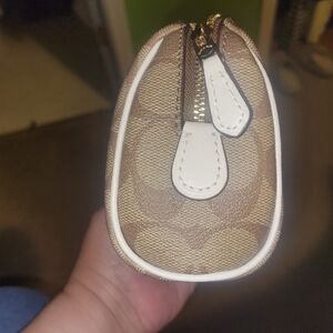 Coach makeup bag. Matching wallet in my closet.